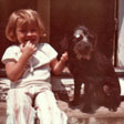 at age 4 and her dog Button with a Button eye